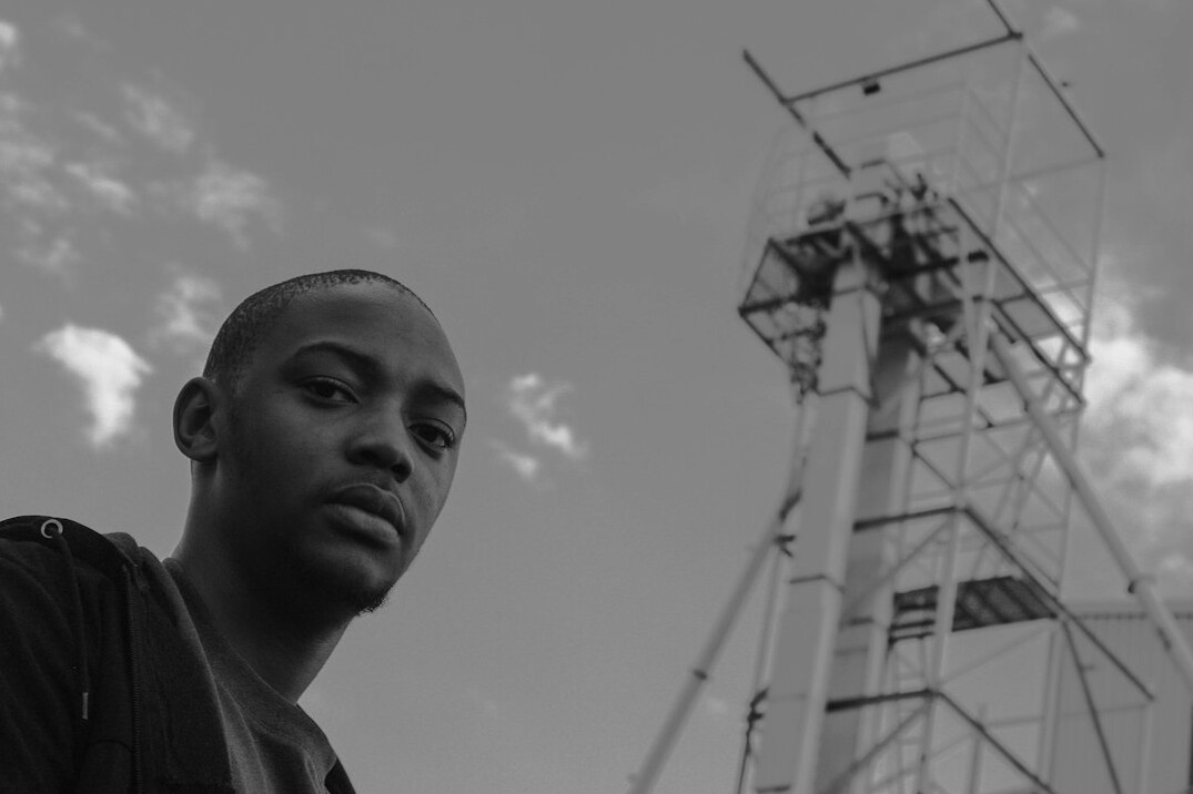 Portrait of a young Black man with short hair, sound engineer